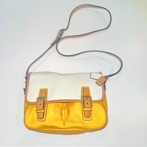Coach small messenger bag with contract colors (yellow, beige, and white).